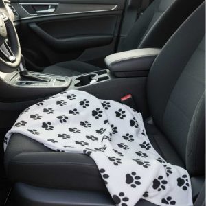 Pet seat protector towel with black paw prints on white microfiber